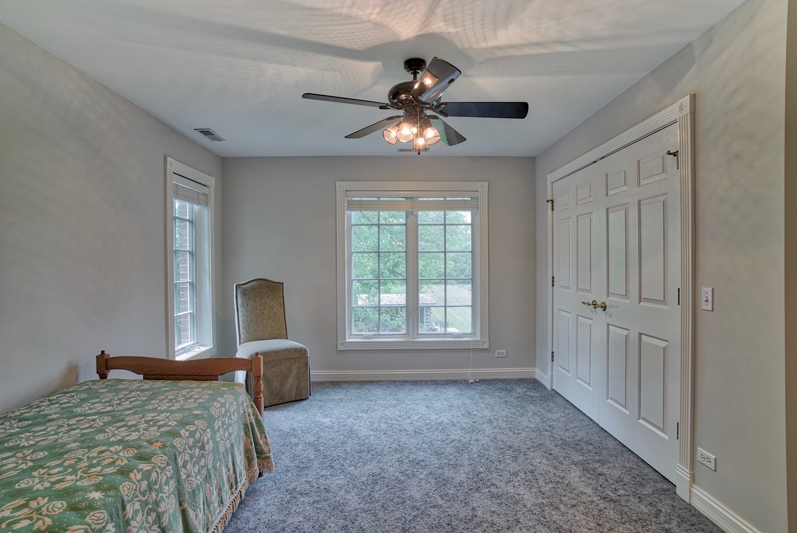 1830 Telegraph Road Lake Forest, IL 60045 - Photo 22 of 31 a bedroom with a bed and a chandelier