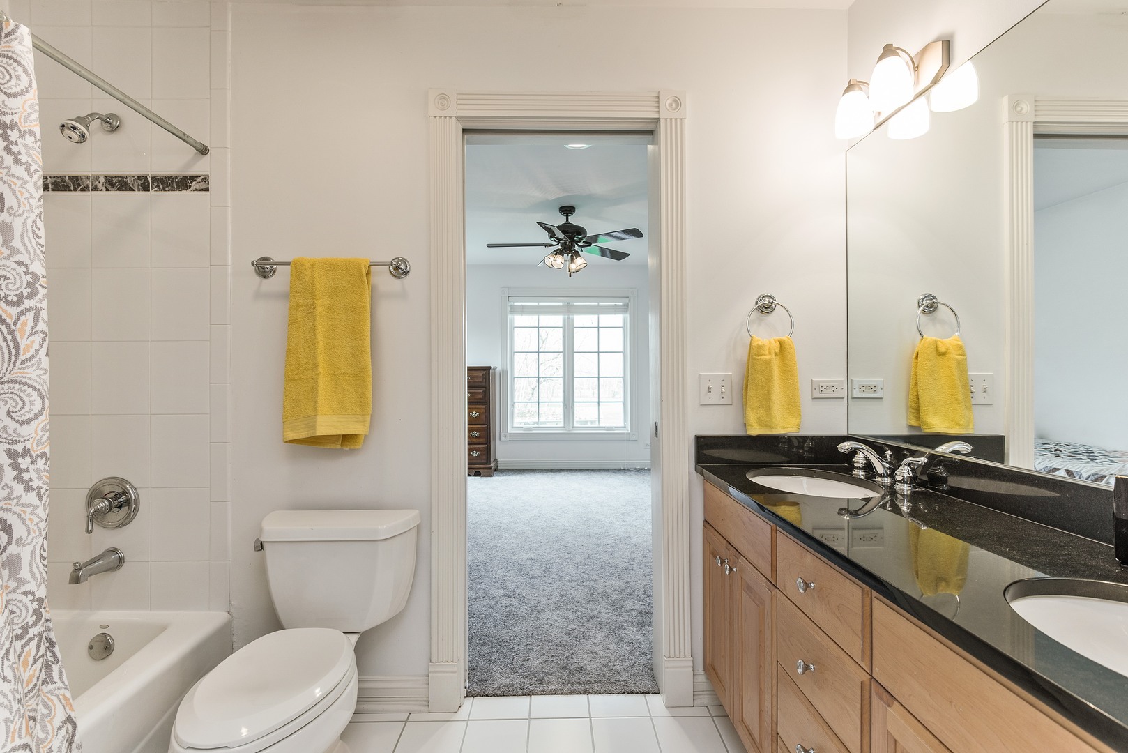 1830 Telegraph Road Lake Forest, IL 60045 - Photo 25 of 31 a bathroom with a granite countertop toilet sink and mirror