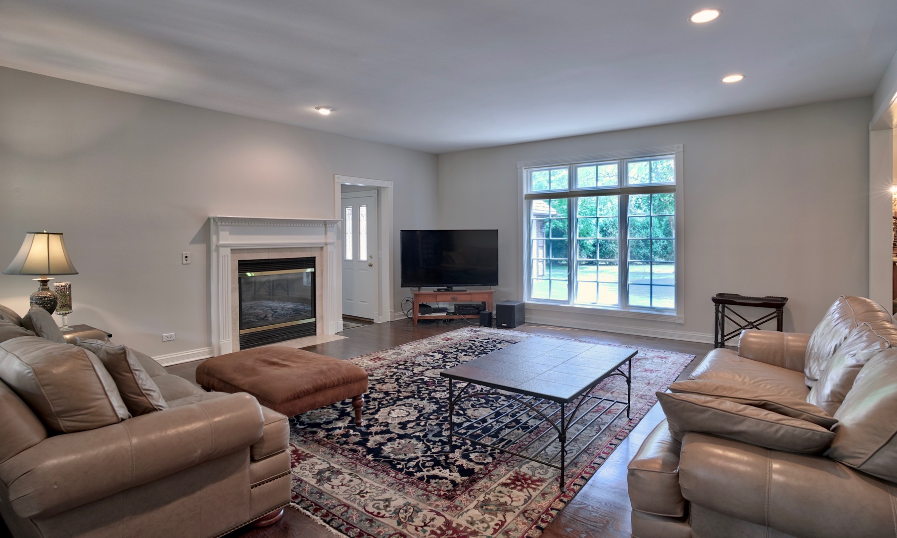 1830 Telegraph Road Lake Forest, IL 60045 - Photo 5 of 31 a living room with furniture a flat screen tv and a fireplace