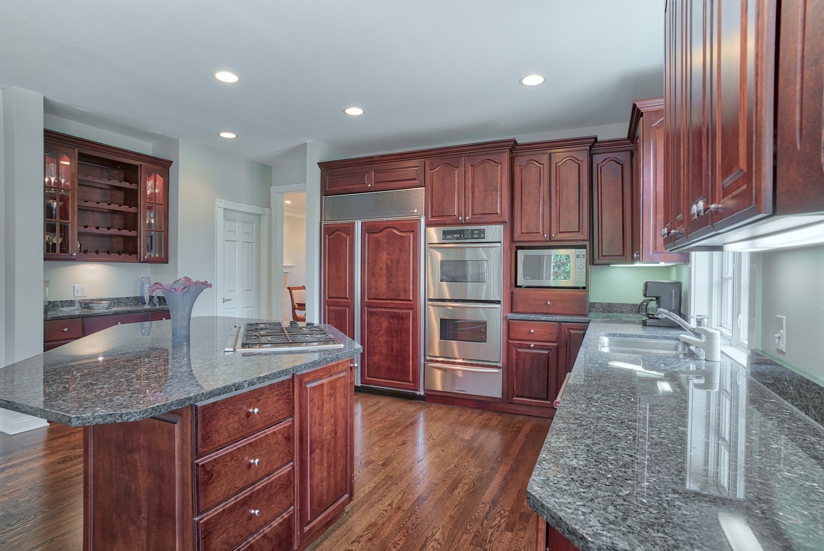 1830 Telegraph Road Lake Forest, IL 60045 - Photo 8 of 31 a kitchen with stainless steel appliances granite countertop wooden cabinets a refrigerator and a sink