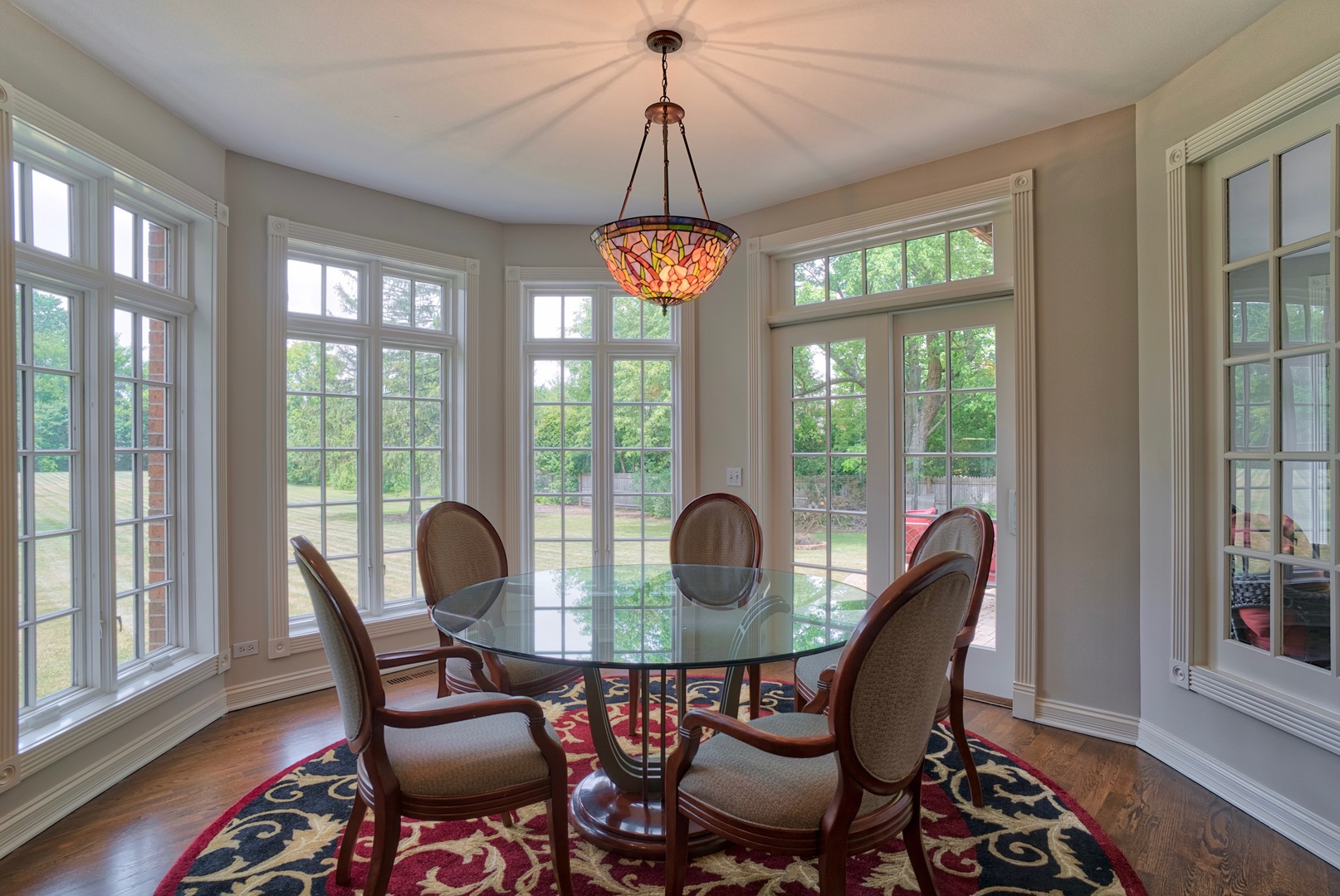 1830 Telegraph Road Lake Forest, IL 60045 - Photo 10 of 31 a dining room with furniture wooden floor a chandelier and windows