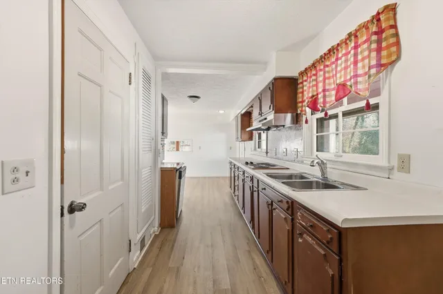 a kitchen with a sink and a window