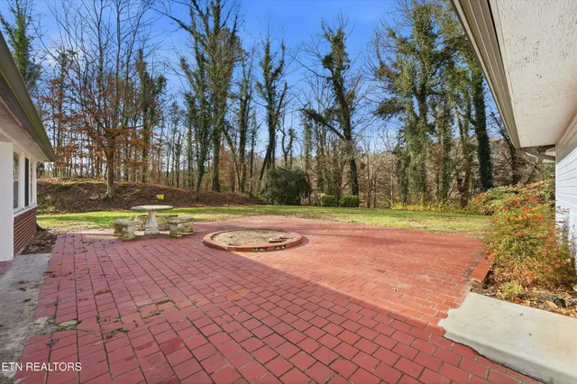 a view of a yard with swimming pool