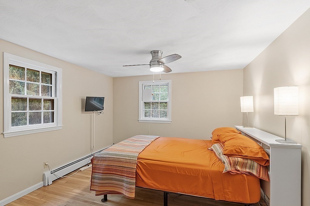 77 Hunt Road Chelmsford, MA 01824 - Photo 11 of 36 a bedroom with a bed and window