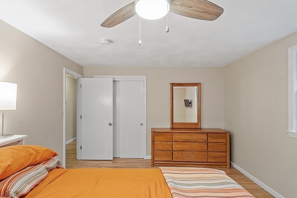 77 Hunt Road Chelmsford, MA 01824 - Photo 12 of 36 a bedroom with a bed and a window
