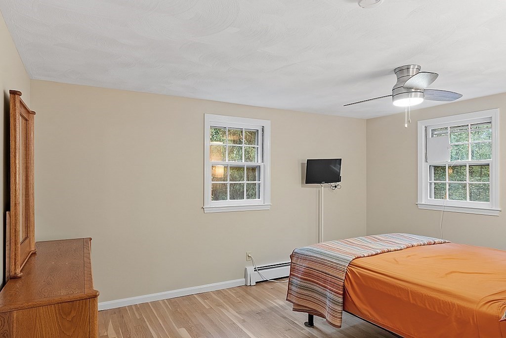 77 Hunt Road Chelmsford, MA 01824 - Photo 13 of 36 a bedroom with a bed and a window