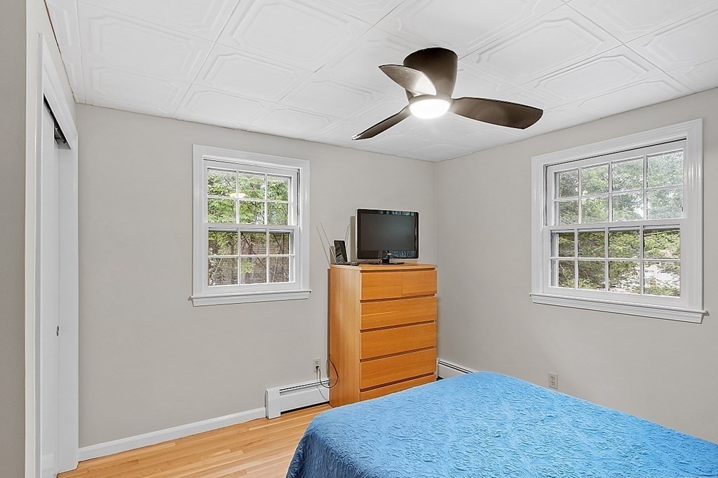 77 Hunt Road Chelmsford, MA 01824 - Photo 14 of 36 a bedroom with furniture and a window