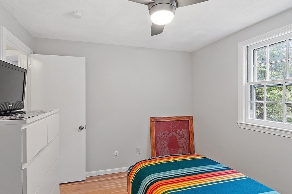 77 Hunt Road Chelmsford, MA 01824 - Photo 16 of 36 a bedroom with bed and flat screen tv