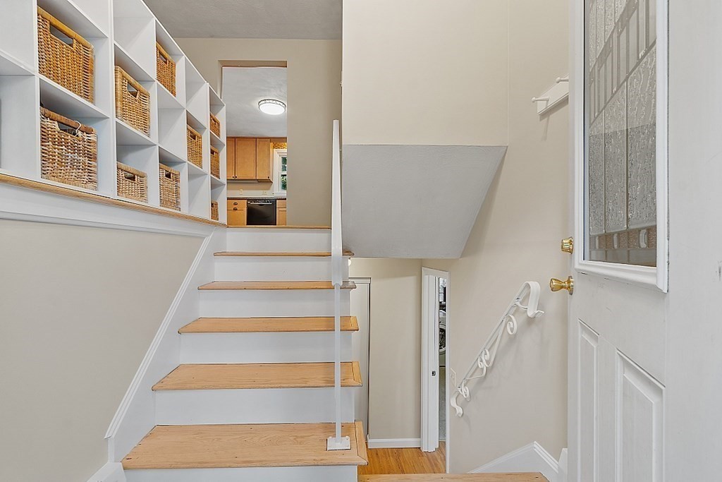 77 Hunt Road Chelmsford, MA 01824 - Photo 19 of 36 a view of staircase with white walls and a window