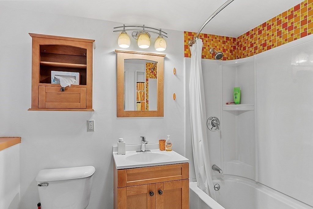 77 Hunt Road Chelmsford, MA 01824 - Photo 26 of 36 a bathroom with a sink a toilet and shower