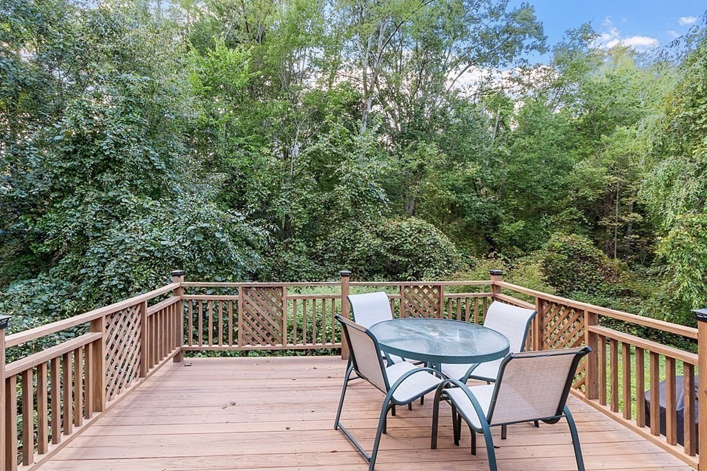 77 Hunt Road Chelmsford, MA 01824 - Photo 27 of 36 a view of a chairs and table on the deck