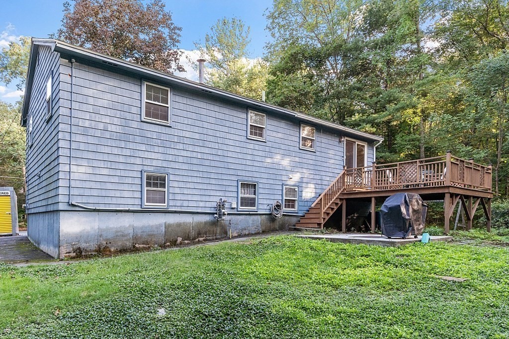 77 Hunt Road Chelmsford, MA 01824 - Photo 29 of 36 a view of a house with a backyard