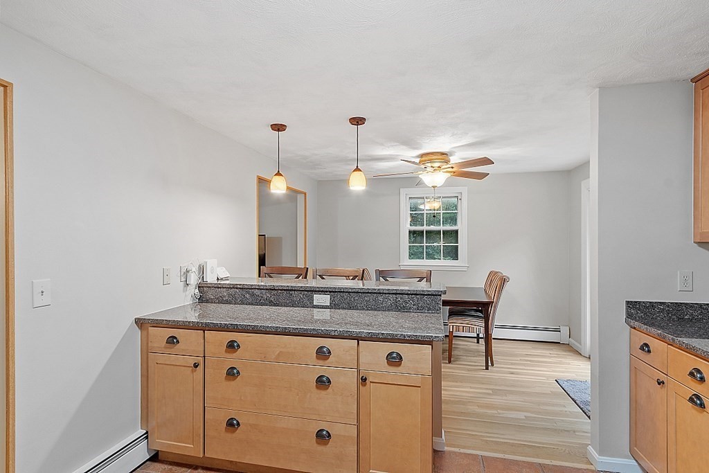 77 Hunt Road Chelmsford, MA 01824 - Photo 6 of 36 a bathroom with a granite countertop sink a mirror and a