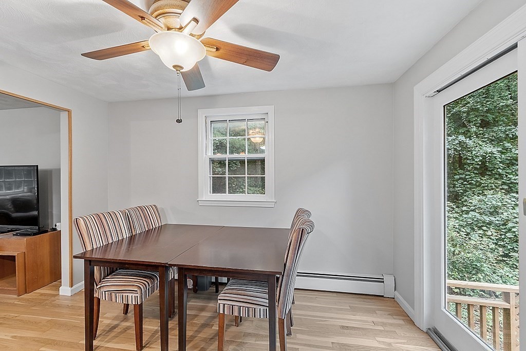 77 Hunt Road Chelmsford, MA 01824 - Photo 10 of 36 a view of a dining room with furniture window and wooden floor