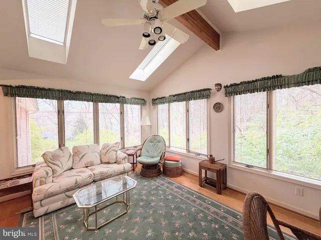 a kitchen with stainless steel appliances granite countertop a stove refrigerator sink and microwave