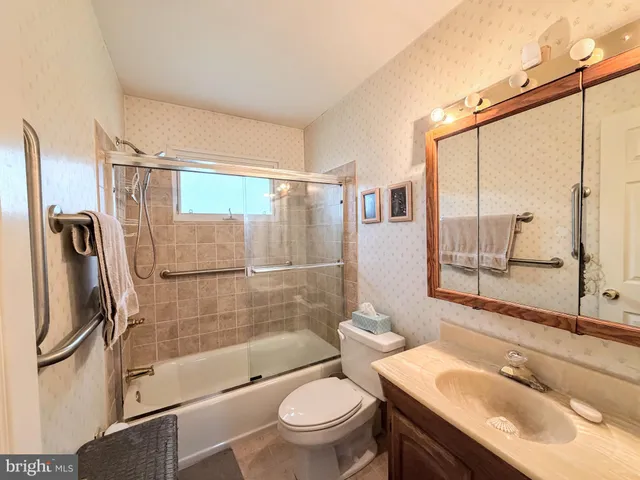 a room with furniture and a bookshelf