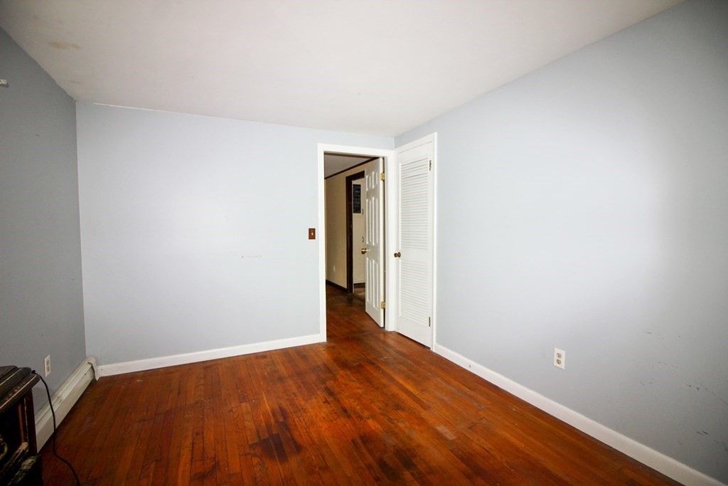 4 Thach Lane Barnstable, MA 02601 - Photo 11 of 18 a view of an empty room with wooden floor