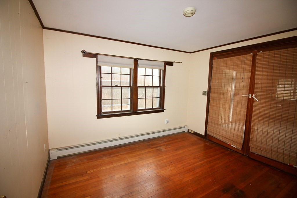 4 Thach Lane Barnstable, MA 02601 - Photo 12 of 18 an empty room with wooden floor and windows