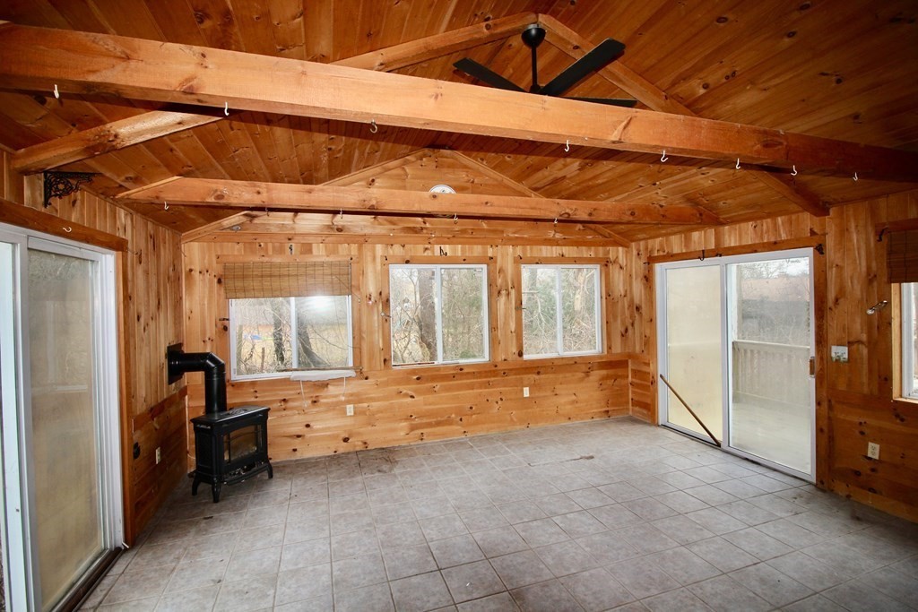 4 Thach Lane Barnstable, MA 02601 - Photo 13 of 18 a view of an empty room with a birdcage and a chair