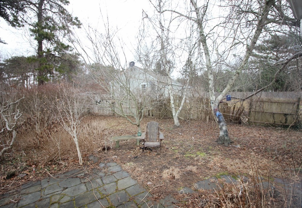 4 Thach Lane Barnstable, MA 02601 - Photo 17 of 18 a view of a dry yard with trees