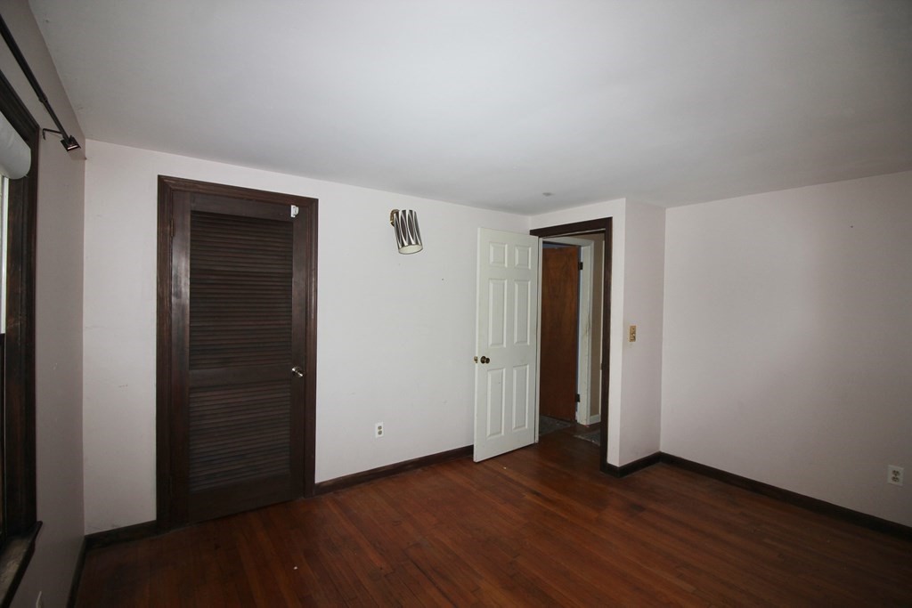 4 Thach Lane Barnstable, MA 02601 - Photo 6 of 18 an empty room with wooden floor and closet