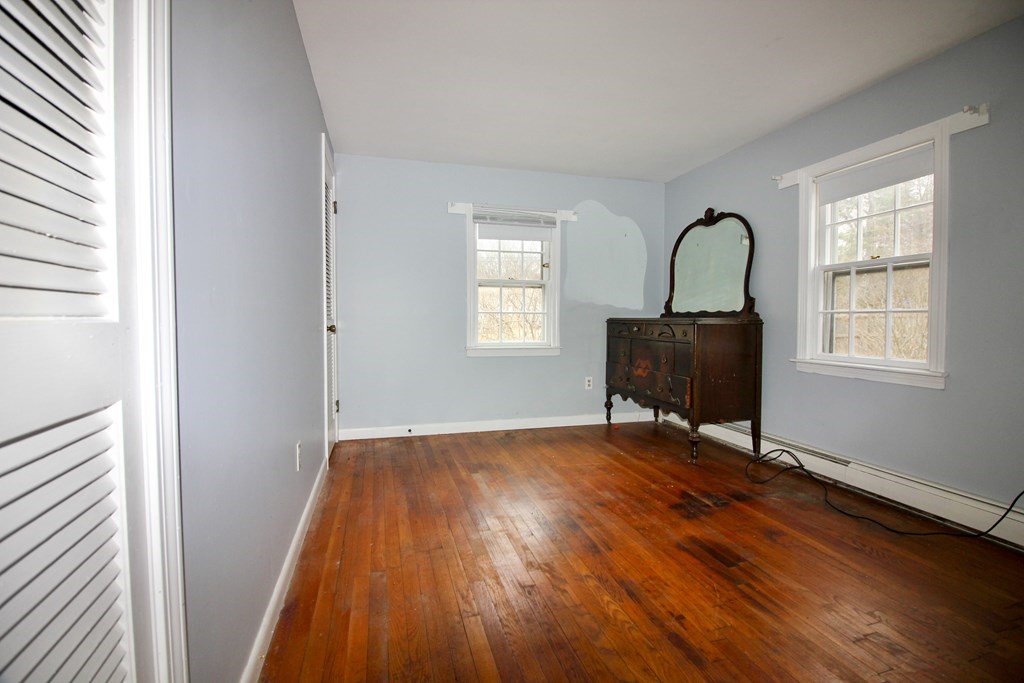 4 Thach Lane Barnstable, MA 02601 - Photo 10 of 18 a view of a livingroom with wooden floor and a window