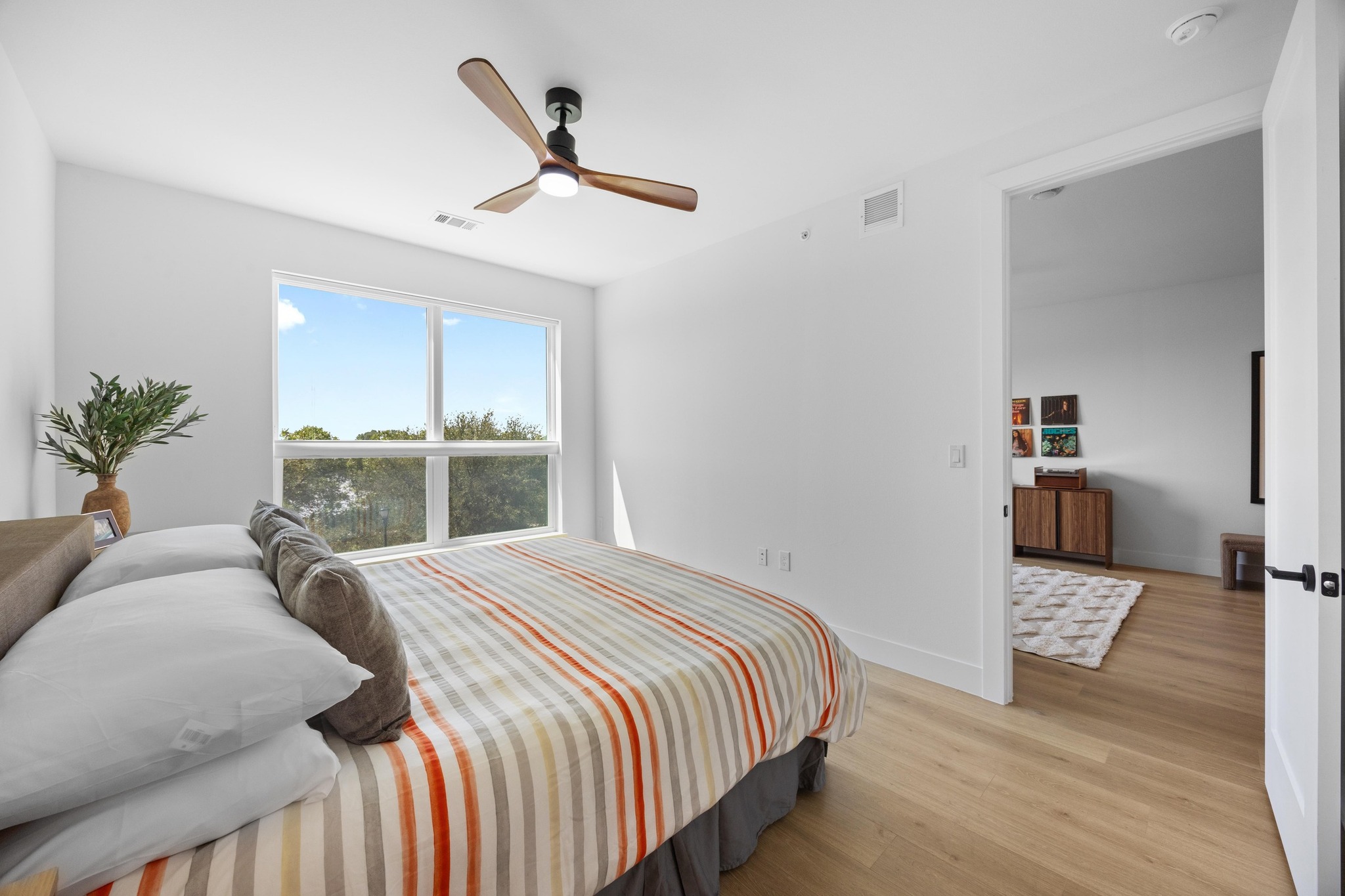 1701 Simond Avenue, Unit 223 Austin, TX 78723 - Photo 16 of 40 a bedroom with a bed and a large window