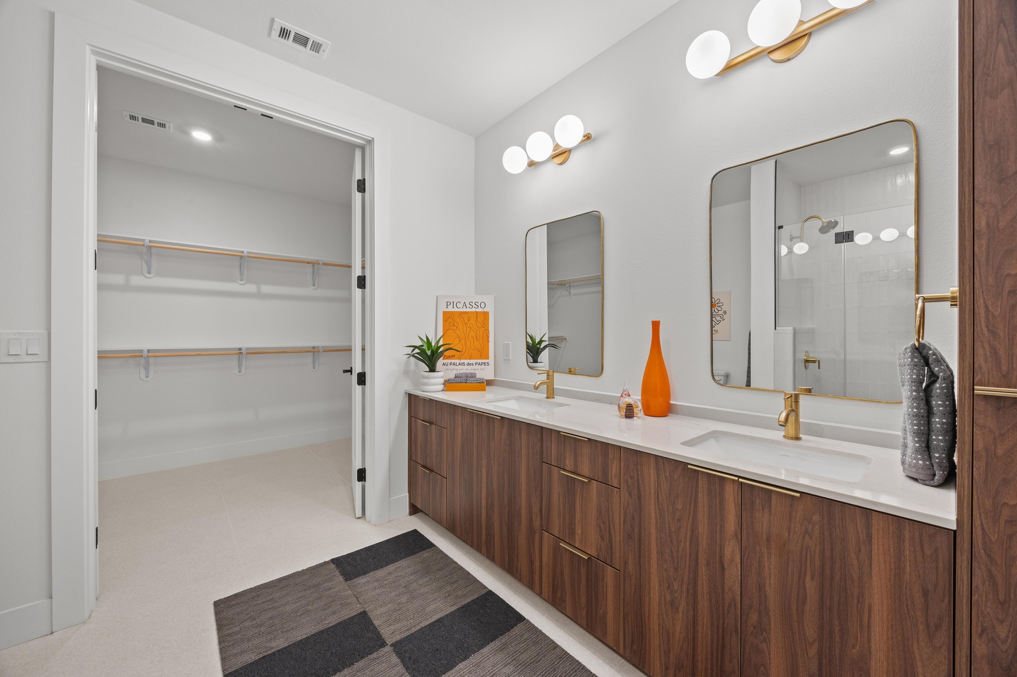 1701 Simond Avenue, Unit 223 Austin, TX 78723 - Photo 18 of 40 a bathroom with a double vanity sink and a mirror