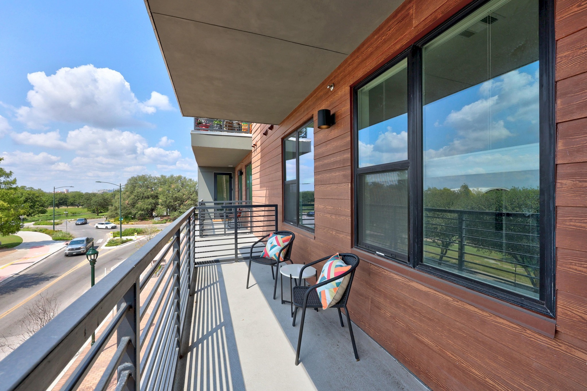 1701 Simond Avenue, Unit 223 Austin, TX 78723 - Photo 28 of 40 a view of a balcony with chairs