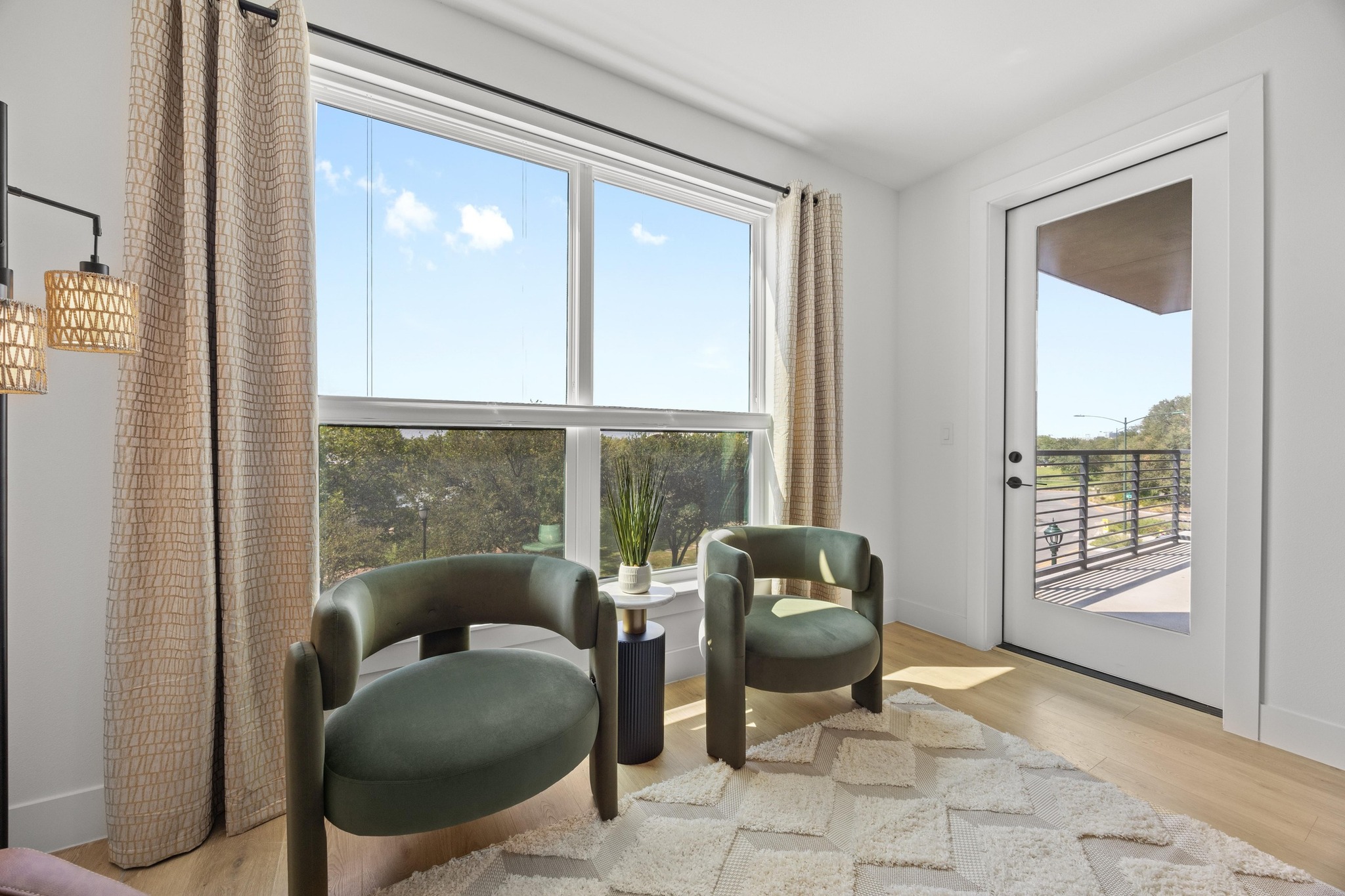 1701 Simond Avenue, Unit 223 Austin, TX 78723 - Photo 4 of 40 a living room with furniture and floor to ceiling windows