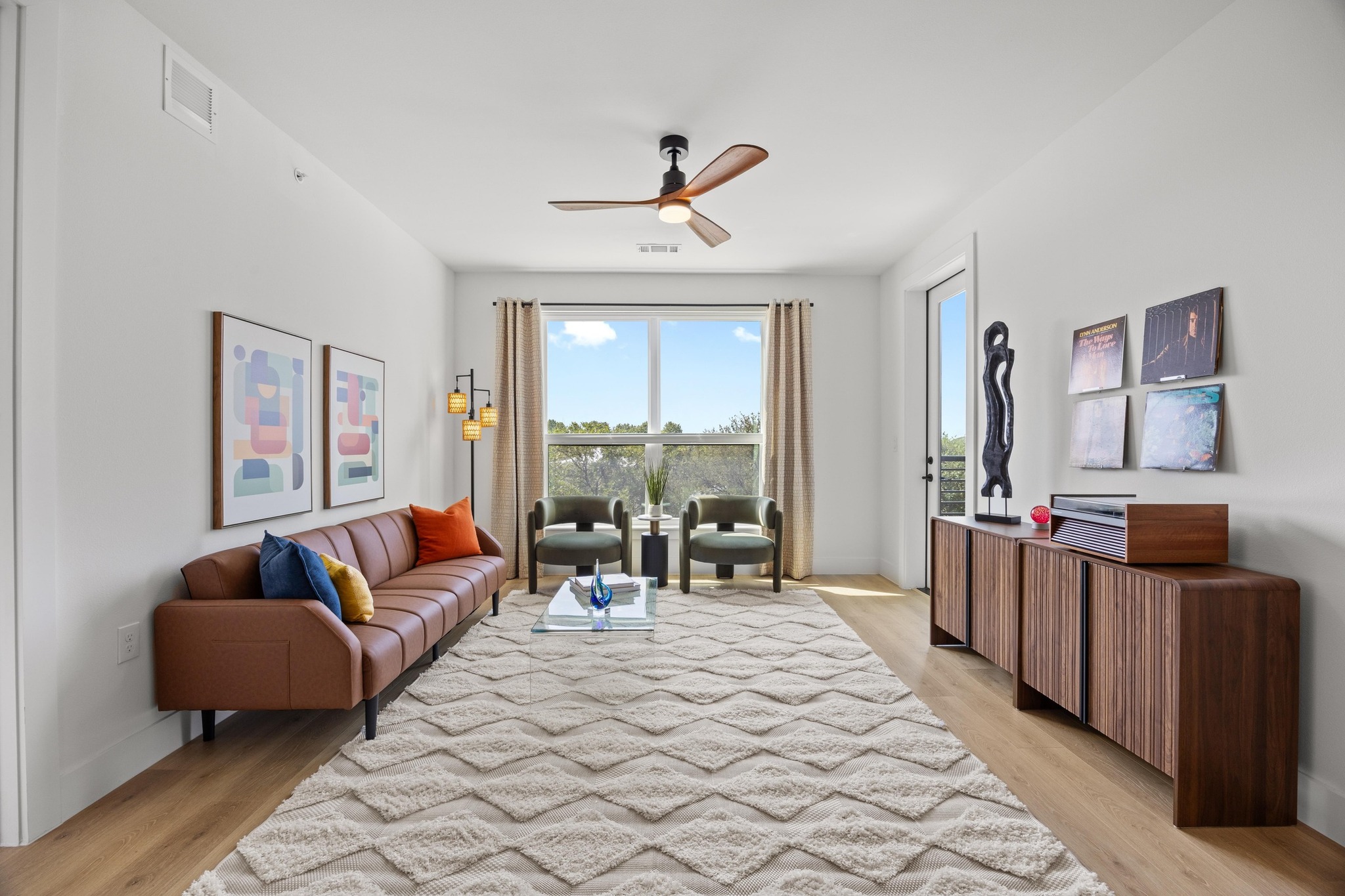 1701 Simond Avenue, Unit 223 Austin, TX 78723 - Photo 6 of 40 a living room with furniture and a large window
