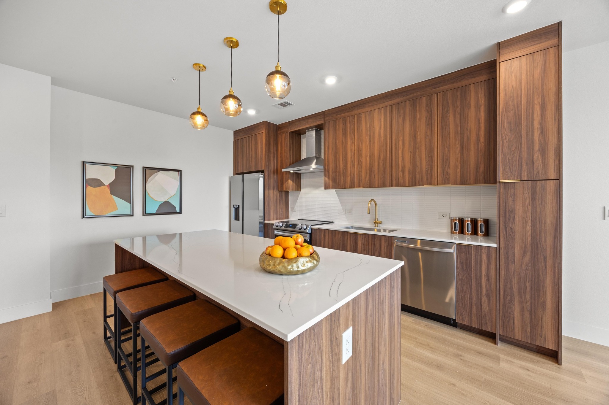 1701 Simond Avenue, Unit 223 Austin, TX 78723 - Photo 9 of 40 a kitchen with stainless steel appliances granite countertop a sink a stove a refrigerator cabinets and wooden floor