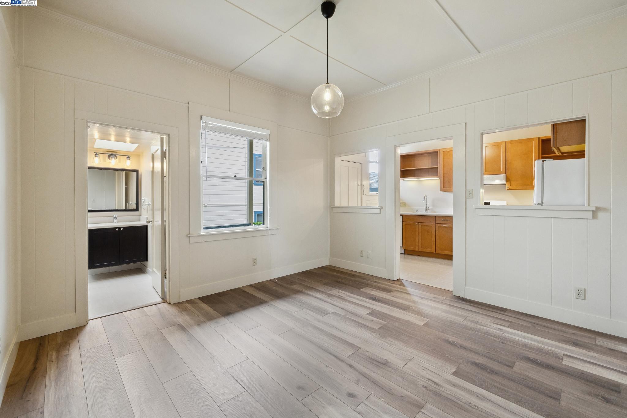 1820 3rd Street Alameda, CA 94501 - Photo 31 of 60 an empty room with wooden floor and windows