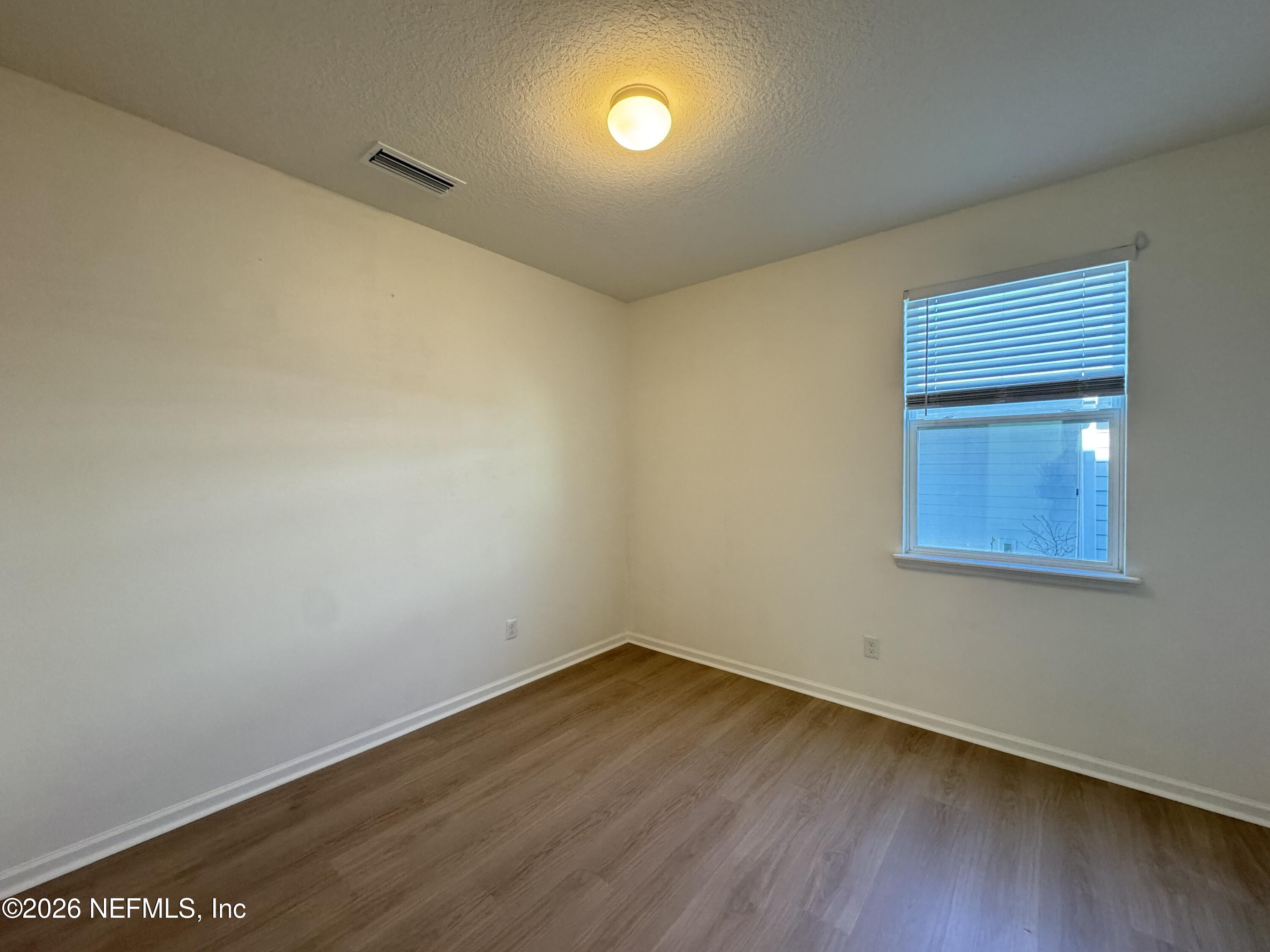 310 Rambling Brk Trail St. Johns, FL 32259 - Photo 11 of 28 a view of empty room with wooden floor