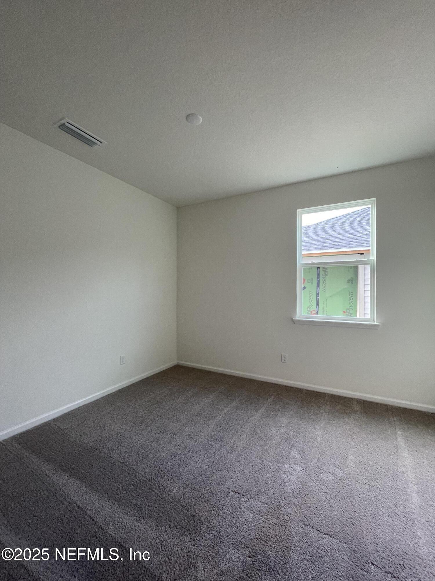 310 Rambling Brk Trail St. Johns, FL 32259 - Photo 12 of 28 an empty room with a window