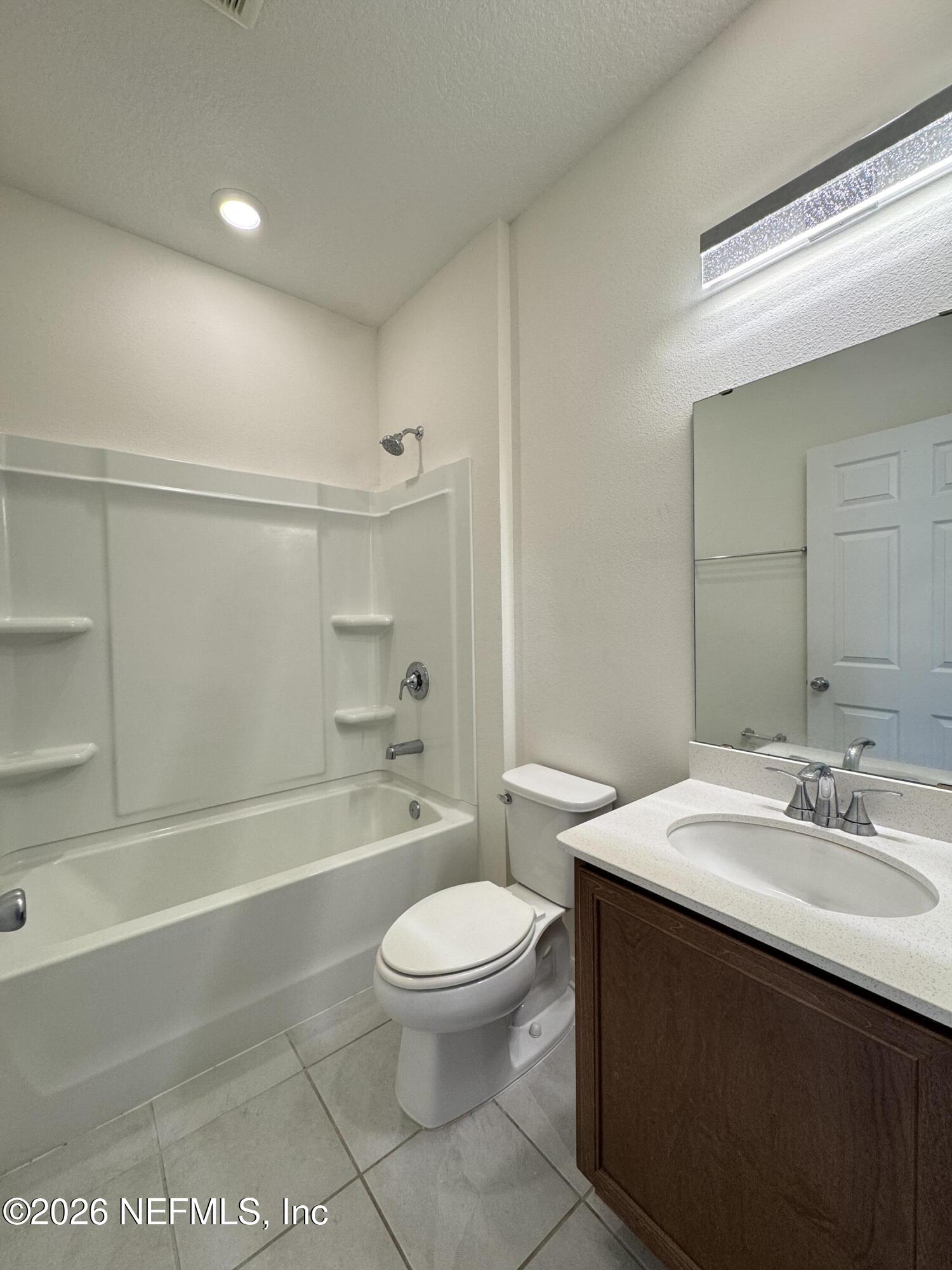 310 Rambling Brk Trail St. Johns, FL 32259 - Photo 13 of 28 a bathroom with a sink a toilet and shower