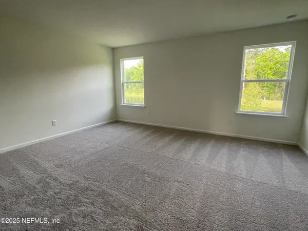 a large kitchen with kitchen island a island a sink stainless steel appliances and cabinets