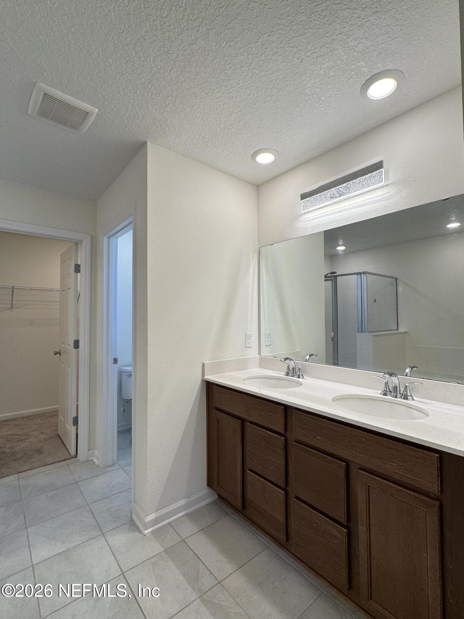 310 Rambling Brk Trail St. Johns, FL 32259 - Photo 28 of 28 a bathroom with a double vanity sink mirror and double
