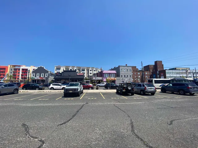 a view of a city street with cars