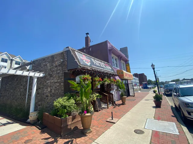 a picture of a building with a bench