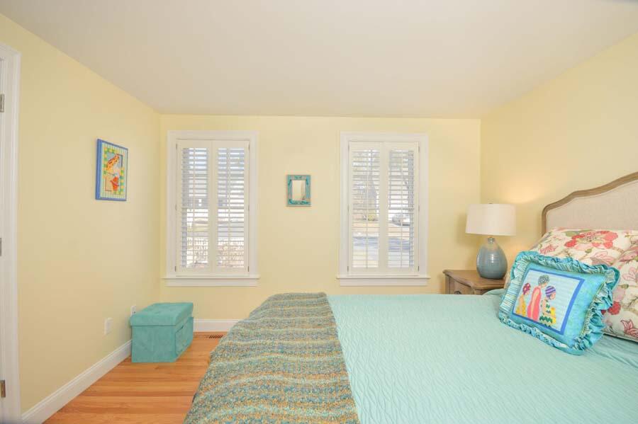 21 Dovetail Lane Cotuit, MA 02635 - Photo 11 of 30 a bedroom with a bed and a window
