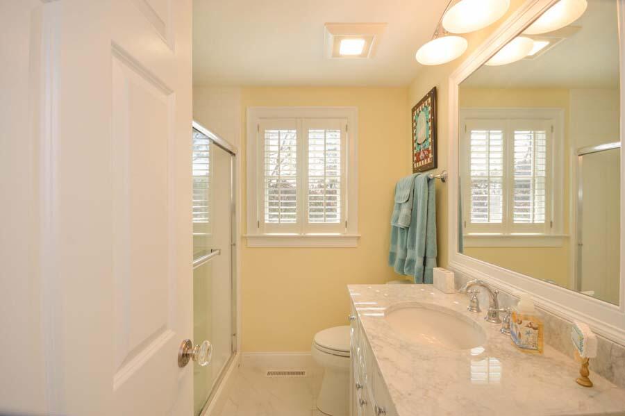 21 Dovetail Lane Cotuit, MA 02635 - Photo 12 of 30 a bathroom with a sink and a mirror