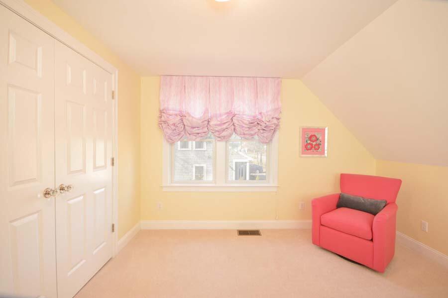 21 Dovetail Lane Cotuit, MA 02635 - Photo 17 of 30 a living room with furniture and a window