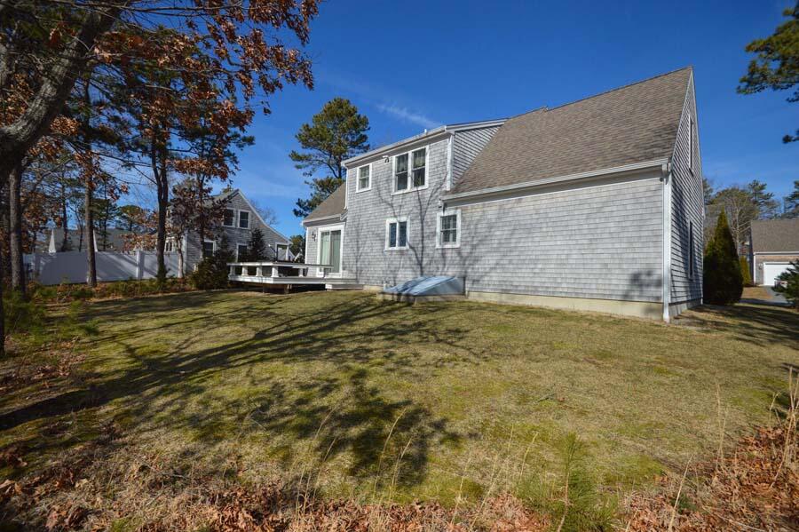 21 Dovetail Lane Cotuit, MA 02635 - Photo 22 of 30 a view of a house with a yard