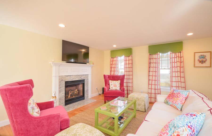 21 Dovetail Lane Cotuit, MA 02635 - Photo 6 of 30 a living room with furniture a flat screen tv and a fireplace