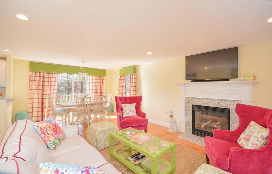 21 Dovetail Lane Cotuit, MA 02635 - Photo 30 of 30 a living room with furniture a fireplace and a flat screen tv