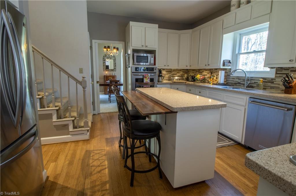 3612 Hunting Ridge Drive High Point, NC 27265 - Photo 7 of 24 Glass tile backsplash and stainless appliances.