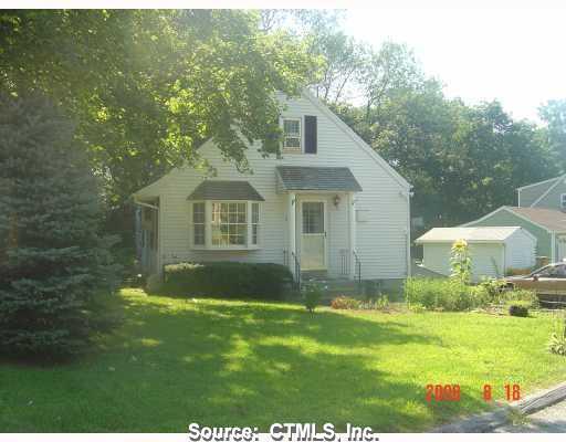 59 Black Point Road East Lyme, CT 06357 - Photo 1 of 1 a front view of a house with a garden