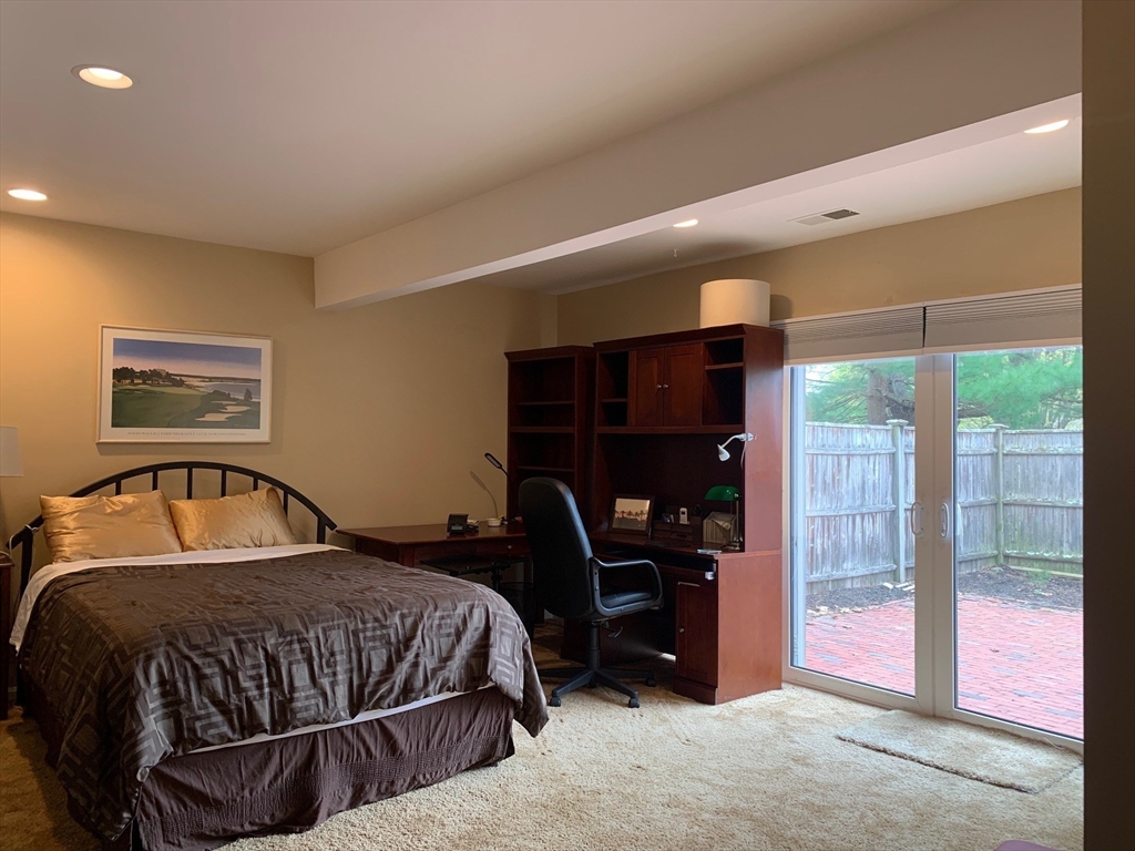 4 Potter Pond, Unit 4 Lexington, MA 02421 - Photo 13 of 15 a bedroom with a bed and a window