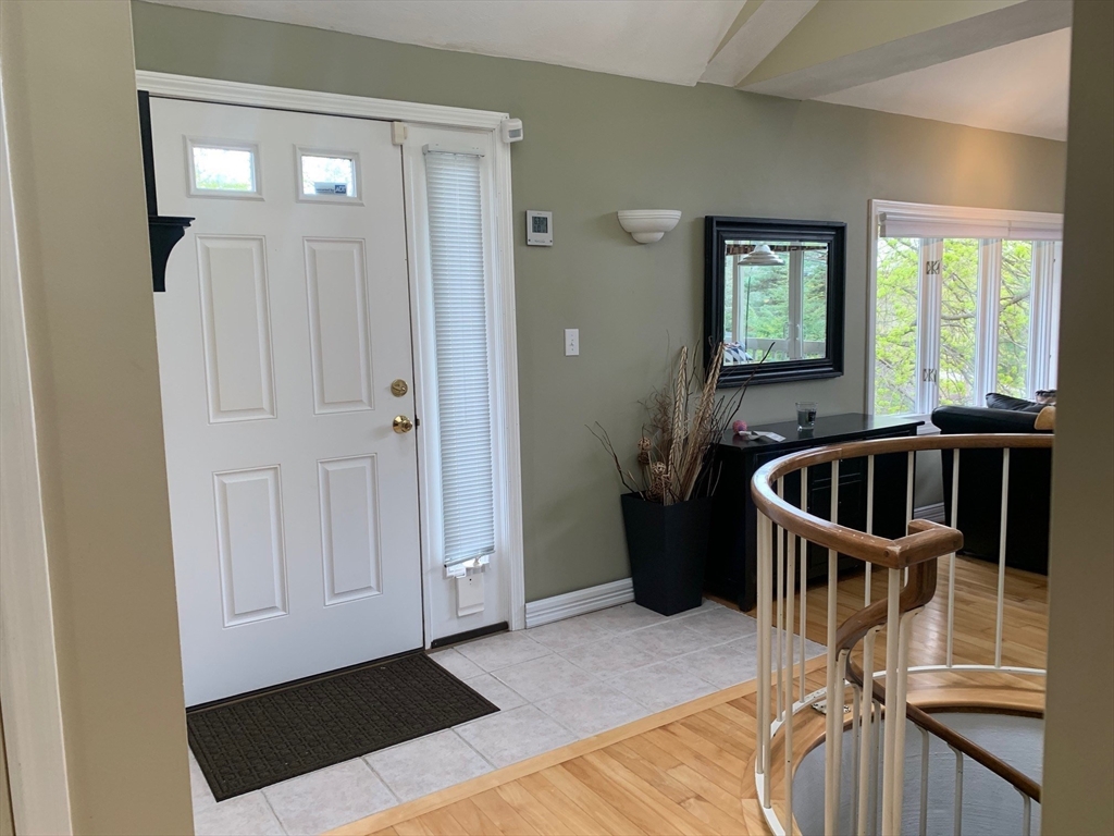 4 Potter Pond, Unit 4 Lexington, MA 02421 - Photo 8 of 15 a view of a livingroom with furniture and front door